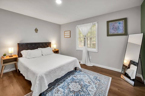 Moroccan-inspired bedroom, blending style and comfort. Sleep soundly on a Tempur-Pedic mattress with high-quality pillows and new linens. The room includes a TV for entertainment, a sound machine for peaceful rest, and a full-length standing mirror