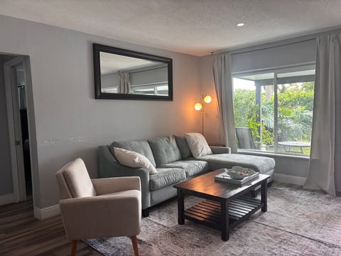 Bright, cozy living room with patio views and plenty of natural light