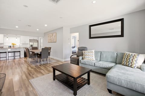 Bright open-plan living with sleek kitchen & comfy sectional