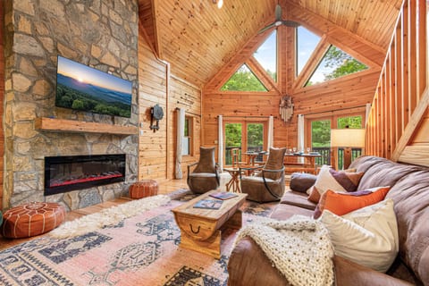 Spacious great room with 25' vaulted ceilings and cozy fireplace.