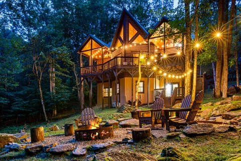 Relax at the cozy fire pit right beside the rushing sounds of the creek