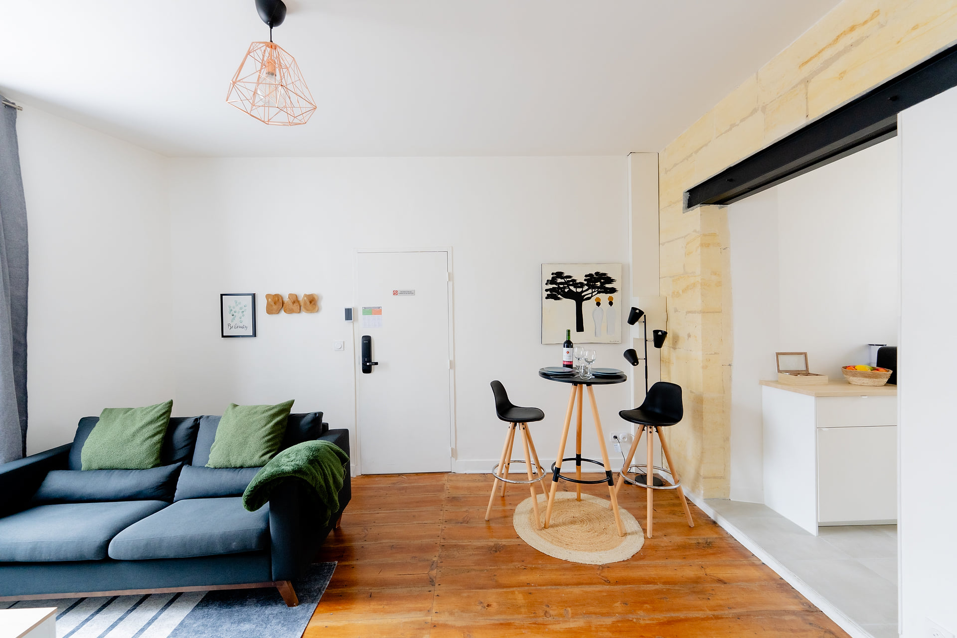 Bright living with hardwood floors, bistro dining, and open kitchen