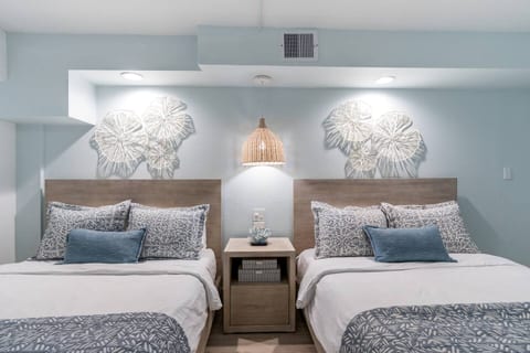 Lighting and fan controls between the beds and USB charging in the nightstand keep you connected while relaxing.