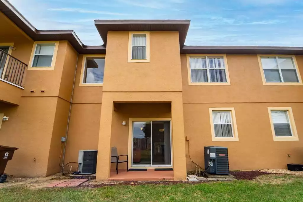 back of townhome showing patio - Regal palms home, gated community ,pool (712CAL) - Davenport