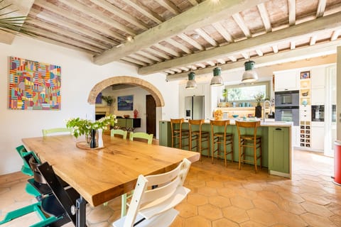 Dining room table + chairs for 10-12 + bar seating (multiple children's/high chairs available).