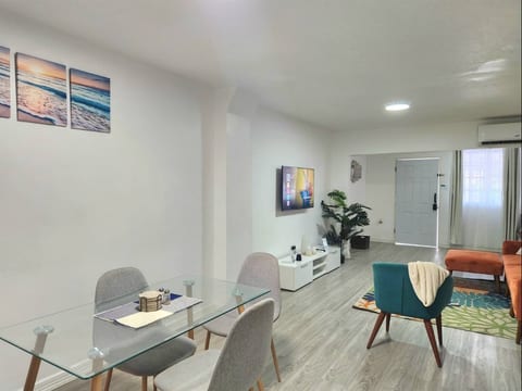 A step-free, fully furnished living room with a dining area is located on the ground floor of the property.