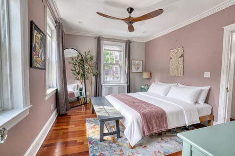 King Bed #2, 50" Tv, ceiling fan, windows providing lots of natural light.