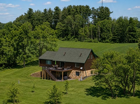 Secluded log cabin with spacious deck and serene countryside views