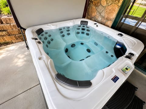 Private, jetted hot tub on covered patio—soak and unwind year-round.