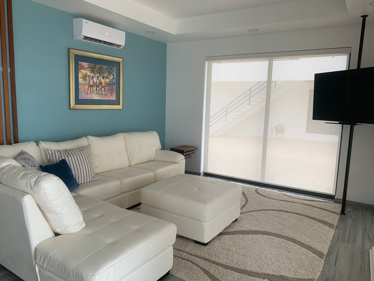 Living room with 55 inch TV in a pole . 
Air conditioning in every room, we have 4 air conditioning units, they are not central air for you to be able to turn them off or on at your pleasure. 