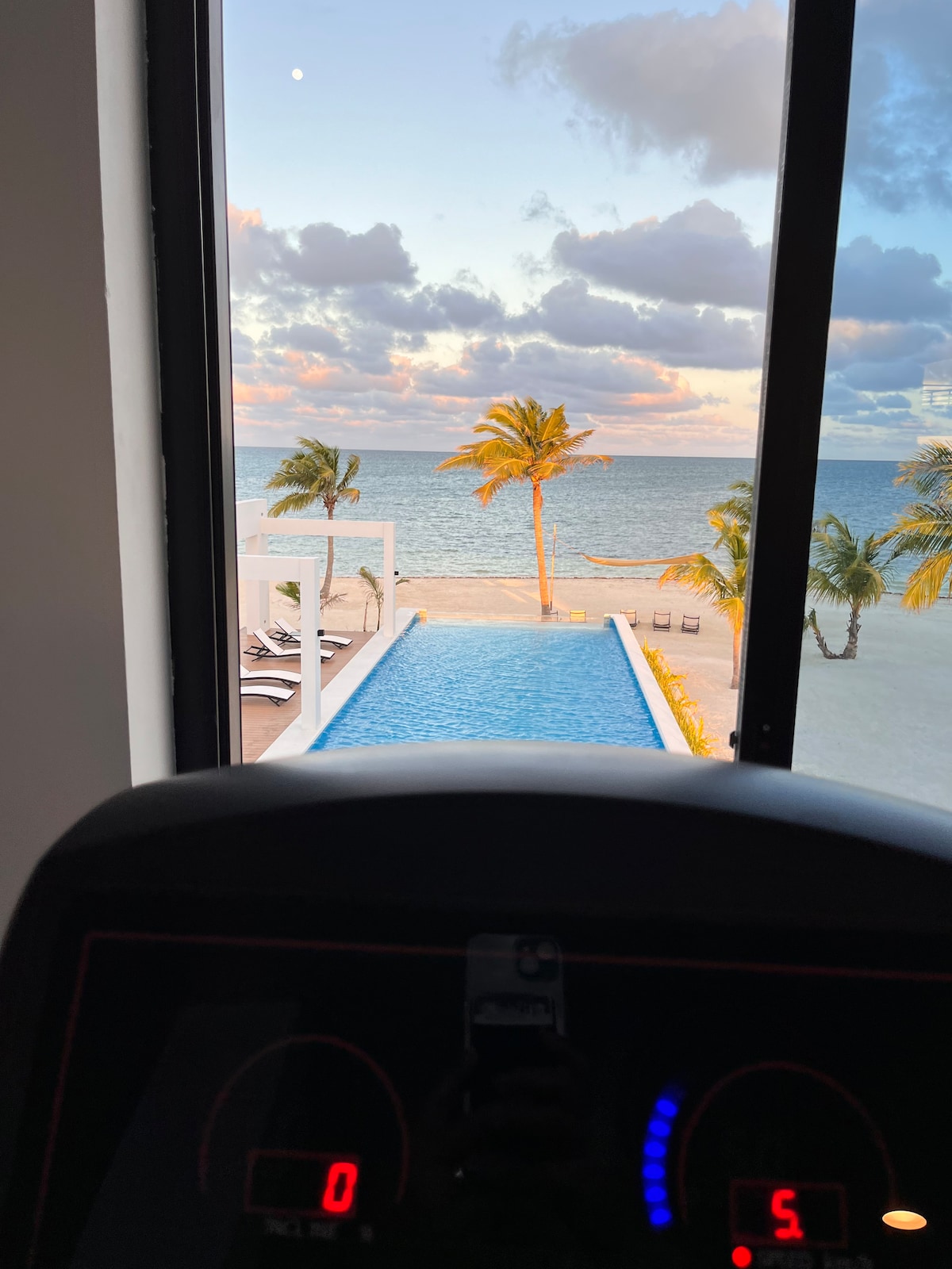 The Gym overlooking the phase 2 pool and the sea 