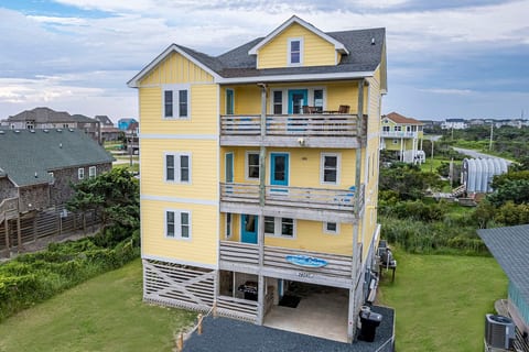 Atlantic Dreams is a 4 story (if you count the stilts) 3000+ square foot, 4 bedroom home with 4 masters and 5.5 total baths. The first floor is dedicated to Game/Pool and Theatre/Movie spaces. The second floor contains 2 king masters bedrooms and 1 master double/double bunk room. The top floor boasts water views in every direction and has a king master bedroom, kitchen, dining area, TV area, and front & back decks with awesome water views.