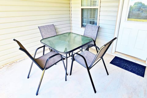 It is located right off the main room in the back. Perfect for 4 to enjoy at sunset or sunrise. Fenced-in backyard for privacy.