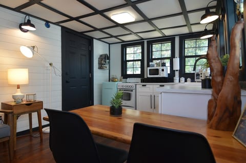 Dining area with table that can easily seat 4.