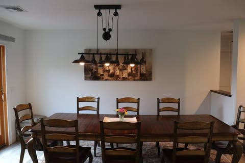 Gather everyone together for comfortable meals at the spacious 8-person dining table. Whether you're enjoying a family breakfast, dinner with friends, or planning your day exploring the Hudson Valley.