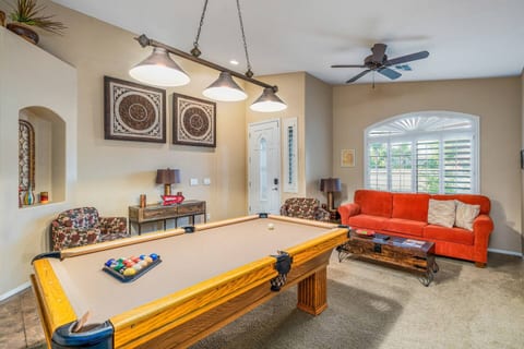 Living room with pool table.Smart TV and cable