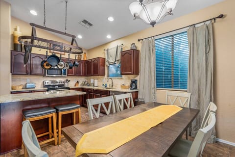 We have room at our table to to fit your 9 guests.  There are 2 leaves for the extension of table and a bench to share for 2. You can also use the island for more room!