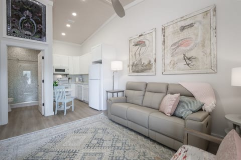 Comfortable Living Space with Italian Leather Couch adjacent to the kitchen