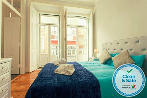 Ensuite Double Bedroom: Bright space with stylish decor and lovely balcony views awaiting your stay!