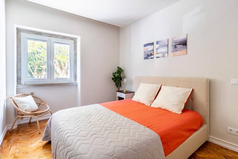 Bedroom Retreat: A sunlit sanctuary with vibrant accents and tranquil views awaits your stay!