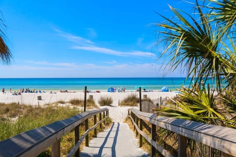 Beach Access Walkway: Direct beach access from the resort — toes in the sand in just minutes