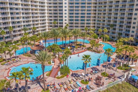 Resort Lagoon Pool – Spectacular view of Shores of Panama’s tropical lagoon-style pool surrounded by palms and beachfront cabanas.
