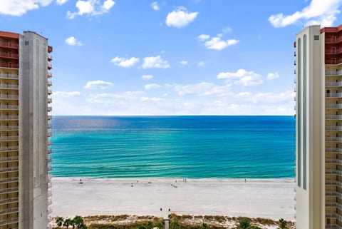 Direct Gulf View – Breathtaking panoramic view of the white-sand beach and emerald Gulf waters from your balcony.