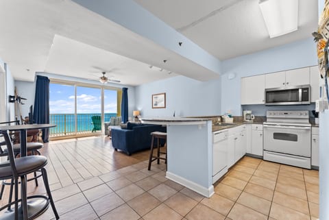 Bright, airy kitchen flows into the living area and private balcony overlooking the sparkling Gulf.
