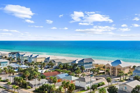 Balcony Ocean View – Left: Breathtaking Gulf views overlooking charming coastal homes and emerald waters.