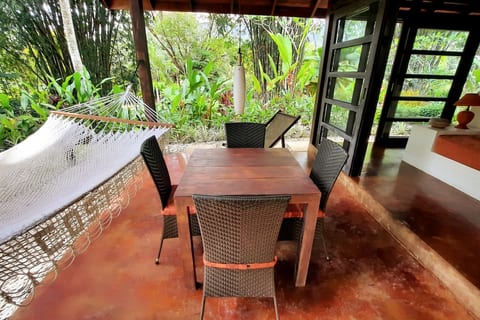 Terrace Dining Oasis: Enjoy al fresco meals surrounded by lush tropical greenery!