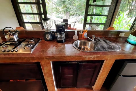 Kitchen Paradise: Whip up meals with quality appliances and serene jungle views!