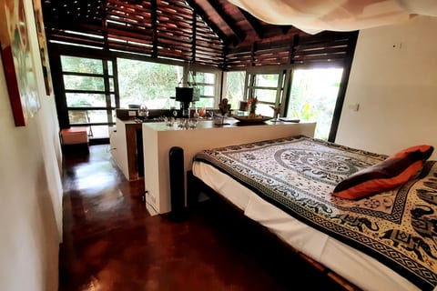 Bedroom Retreat: Enjoy vibrant nature views from this spacious airy sanctuary with stylish decor!