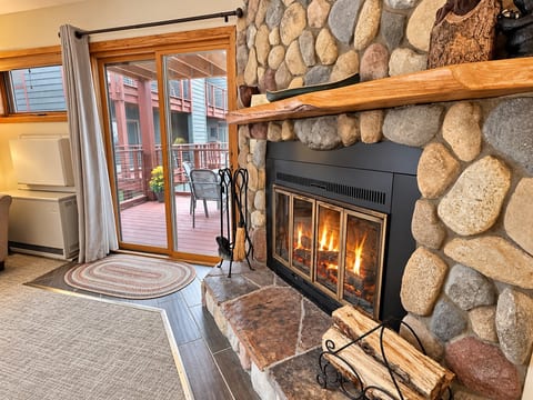 Cozy up to the real wood burning fireplace