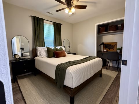 Queen bedroom with desk area