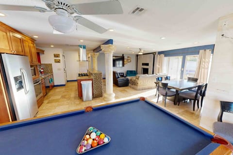 "Experience the ultimate in upscale living. This expansive space offers a gourmet kitchen, multiple living spaces, and a billiards table for endless entertainment. Perfect for family gatherings and sophisticated soirées."