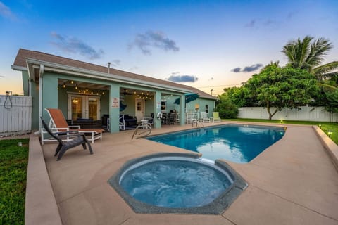 Back Patio with Hot Tub and Pool in the foreground.