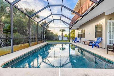 Enjoy the heated pool in the screened pool house.