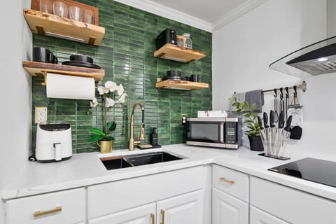 Bright, simple, and fully equipped — a kitchen that keeps things effortless.