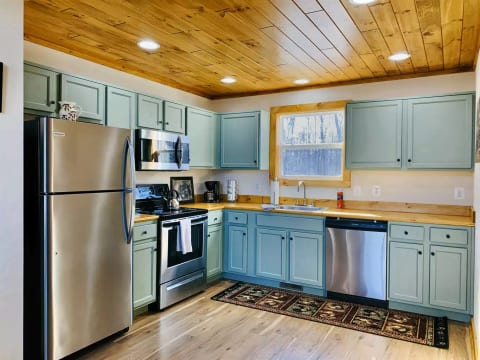 Full kitchen with stainless appliances and all the cookware you need