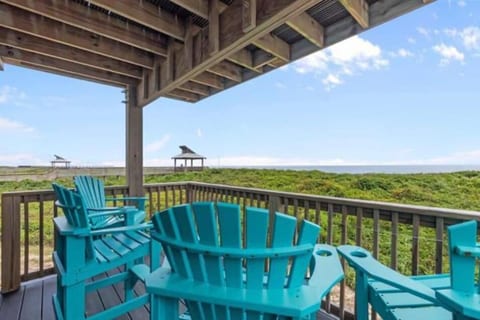 balcony with 4 bar height chairs