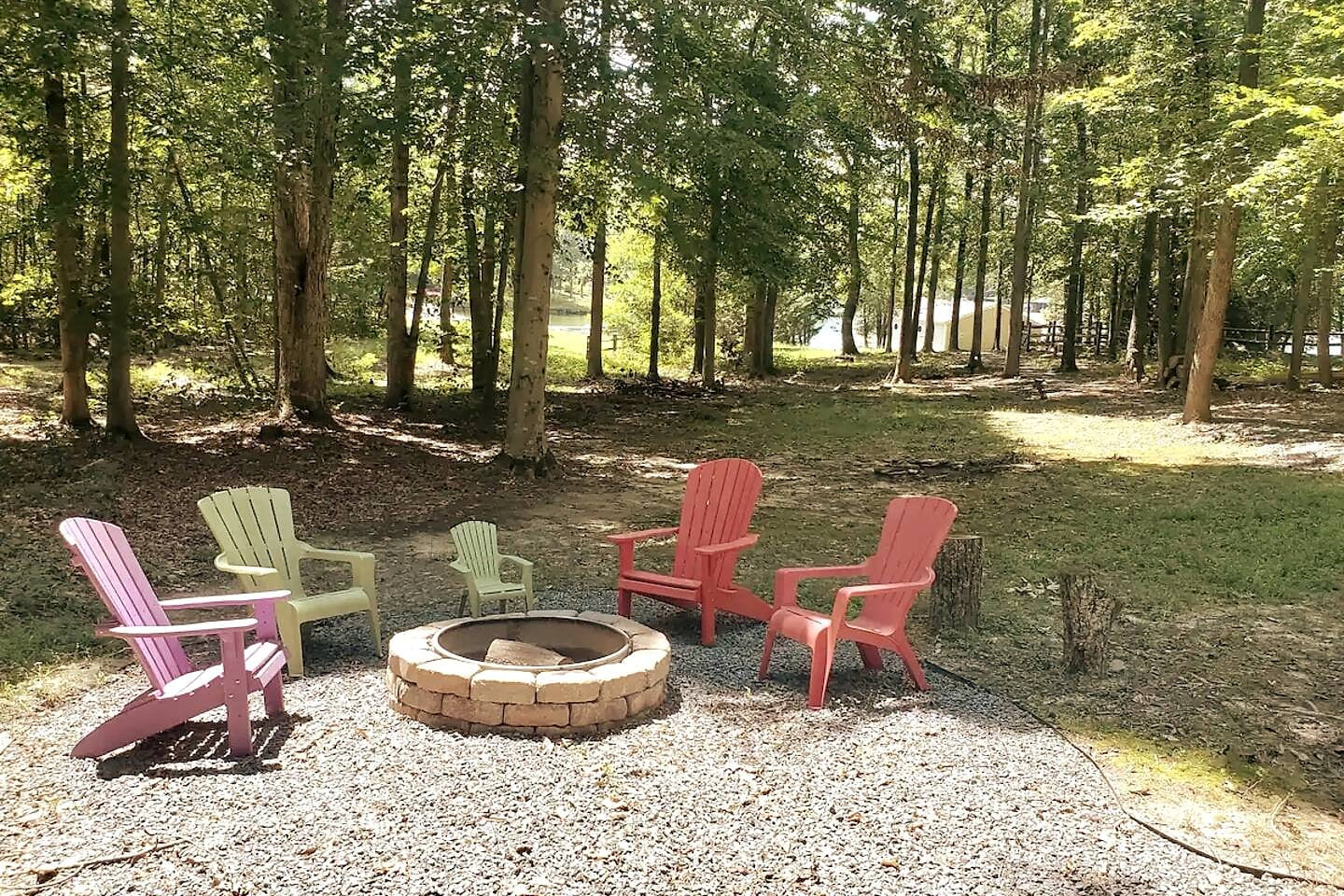 Gather around our lakeside fire pit in comfy Adirondack chairs. Enjoy serene evenings under the stars with friends and family in your private woodland escape!
