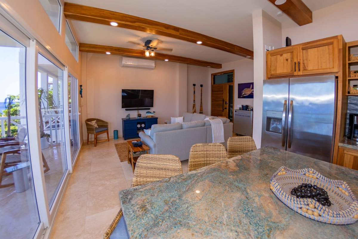 Modern counter height bar that seats 3.  There is an outdoor covered dining space for 4 on the covered patio. 