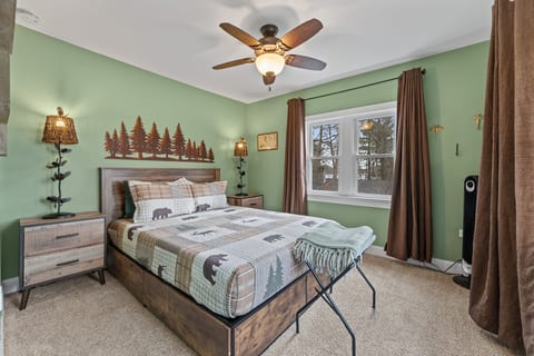 Cozy rustic bedroom with forest views and warm lodge-style charm