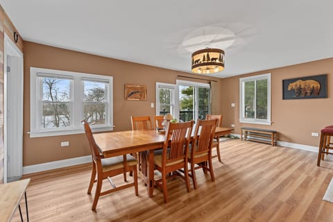 Bright dining room with seating for 6 and scenic outdoor views