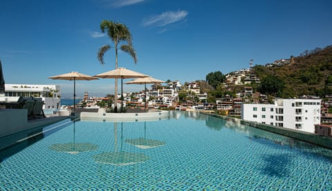 Soak in endless views from the rooftop infinity pool—where the mountains, city, and sky meet in one breathtaking panorama.