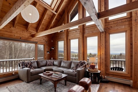 Best view of the mountain range and Jay Peak from your sitting spot in the living room. Opens up to the dining. Wood stove is not available for use at this time. Board games and books provided.