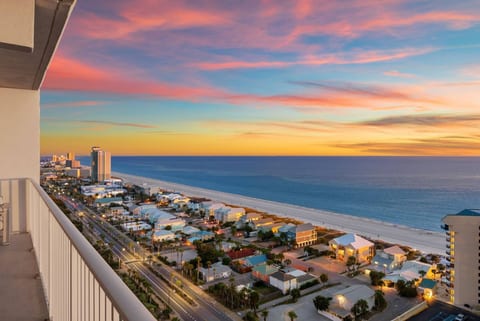 Balcony Sunset View – Stunning panoramic Gulf and city views from your private beachfront balcony.