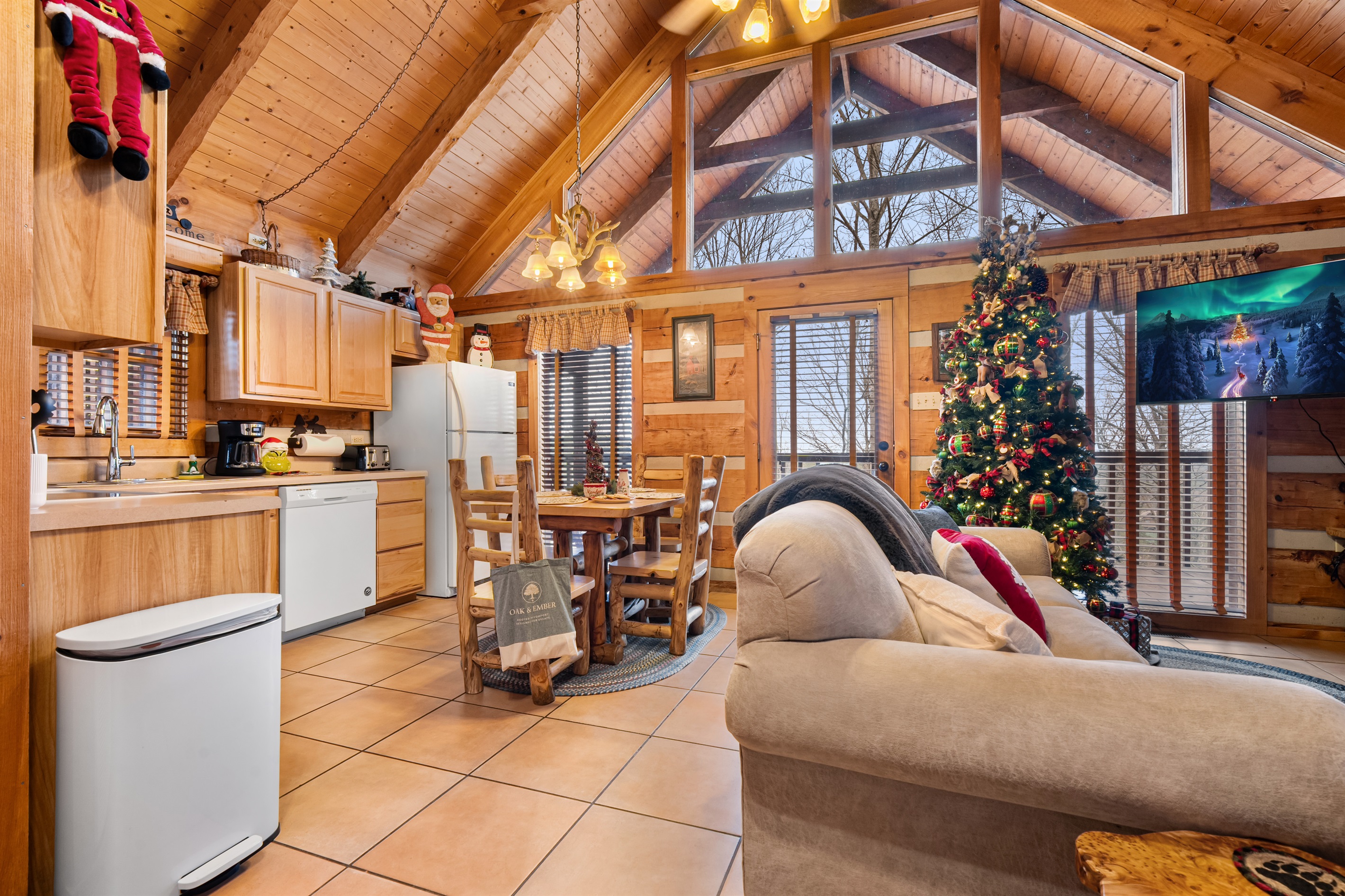 Enjoy the heart of the home—Nestled Oaks’ cozy kitchen and dining space, beautifully decorated for the holidays.