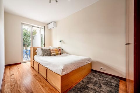 Bedroom: Bright and airy retreat with a stylish wooden bed and beautiful garden views! || bedroom 3 ||