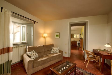 Spacious and comfortable living room with smart TV, high quality double sofa bed and single sofa beds, desk and chair.